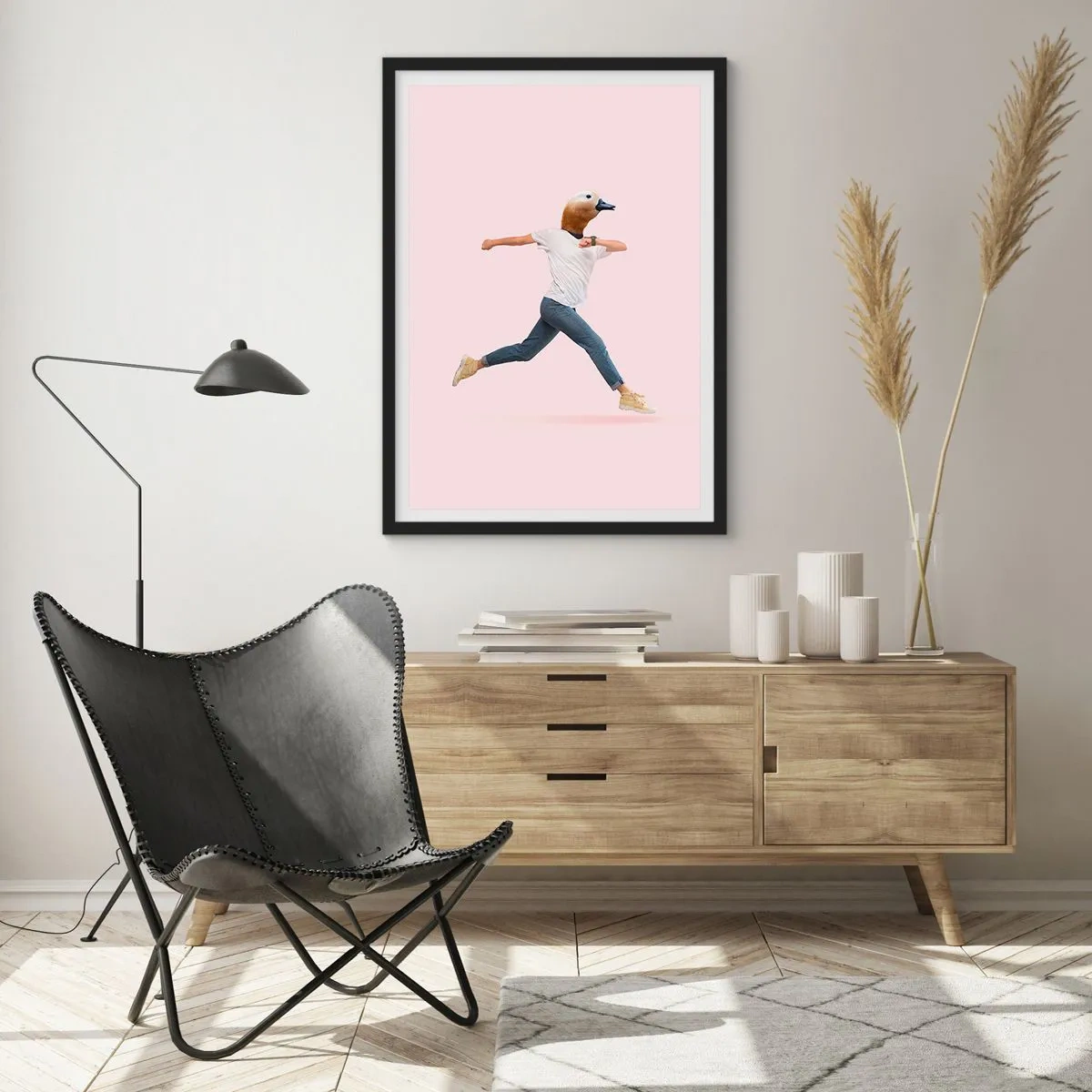 Poster in black frame - A running figure with a bird's head on a pink background - 50x70cm - Pinch of Absurd - Modern wall decoration for the living room and bedroom ARTTOR