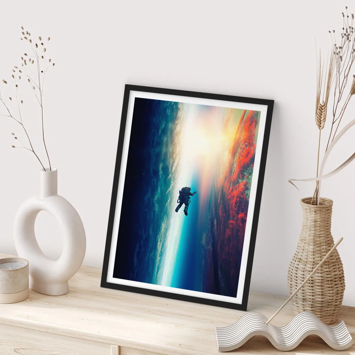 Poster in black frame - Astronaut in space with the Earth and the sun in the background - 50x70cm - Confronting the Universe - Modern wall decoration for the living room and bedroom ARTTOR