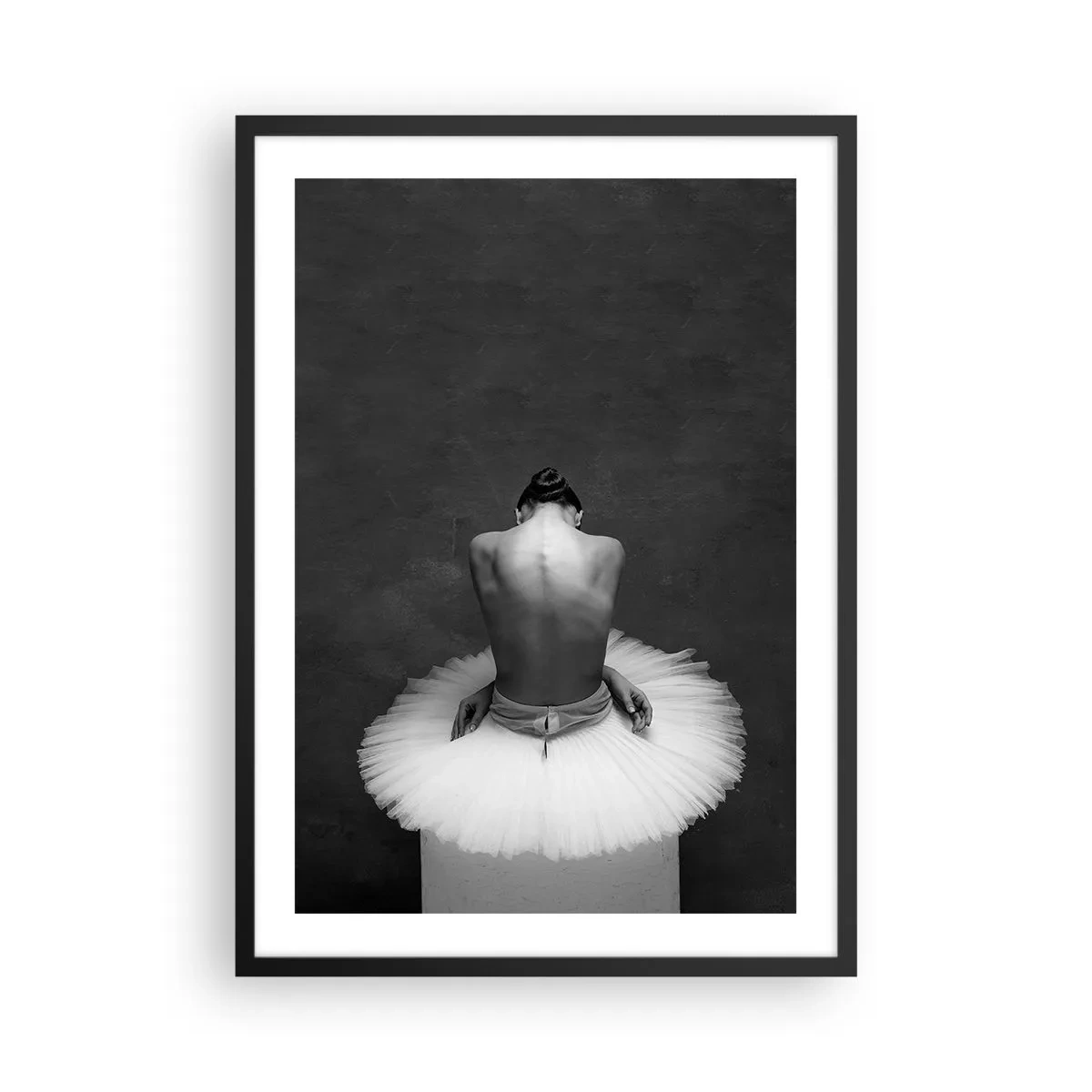 Poster in black frame - Black and white portrait of a ballerina sitting on a platform - 50x70cm - It Is Blossoming - Modern wall decoration for the living room and bedroom ARTTOR