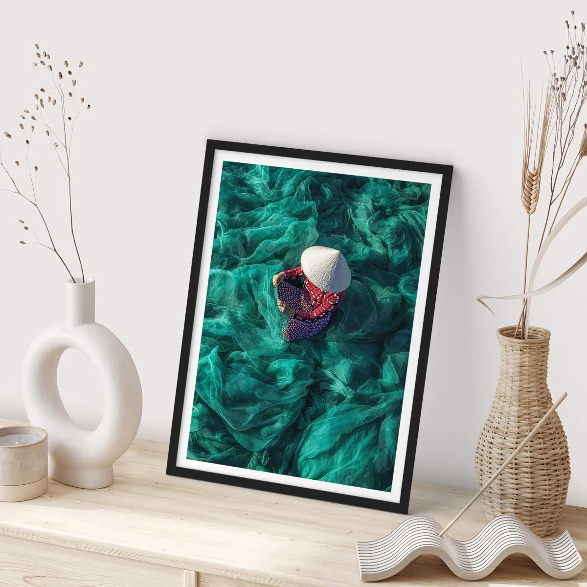 Poster in black frame - A person wearing a hat among green fishing nets - 50x70cm - In the Sea of Nets - Modern wall decoration for the living room and bedroom ARTTOR