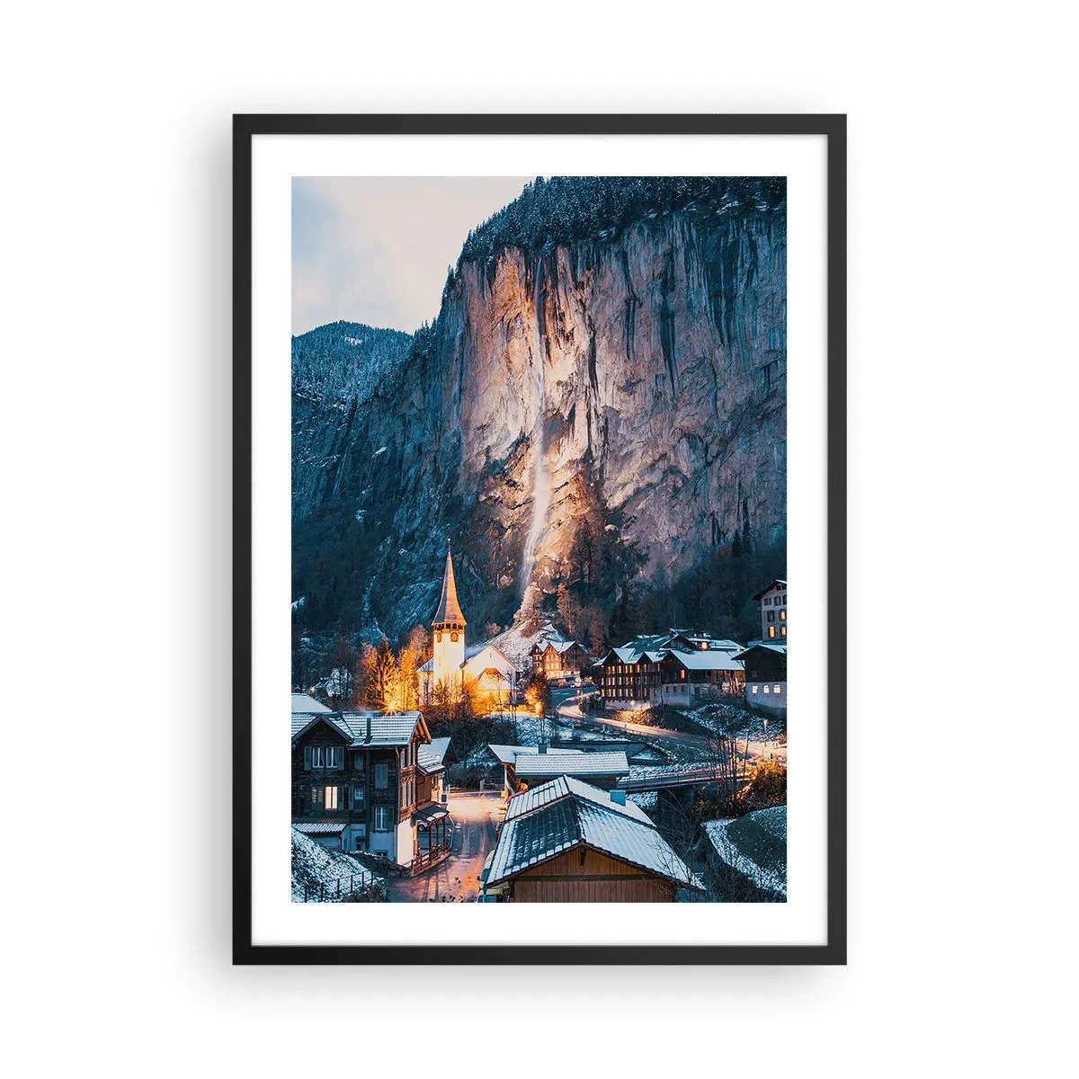 Poster in black frame - Illuminated winter village at the foot of the cliff - 50x70cm - Sparkling Winter Spirit - Modern wall decoration for the living room and bedroom ARTTOR