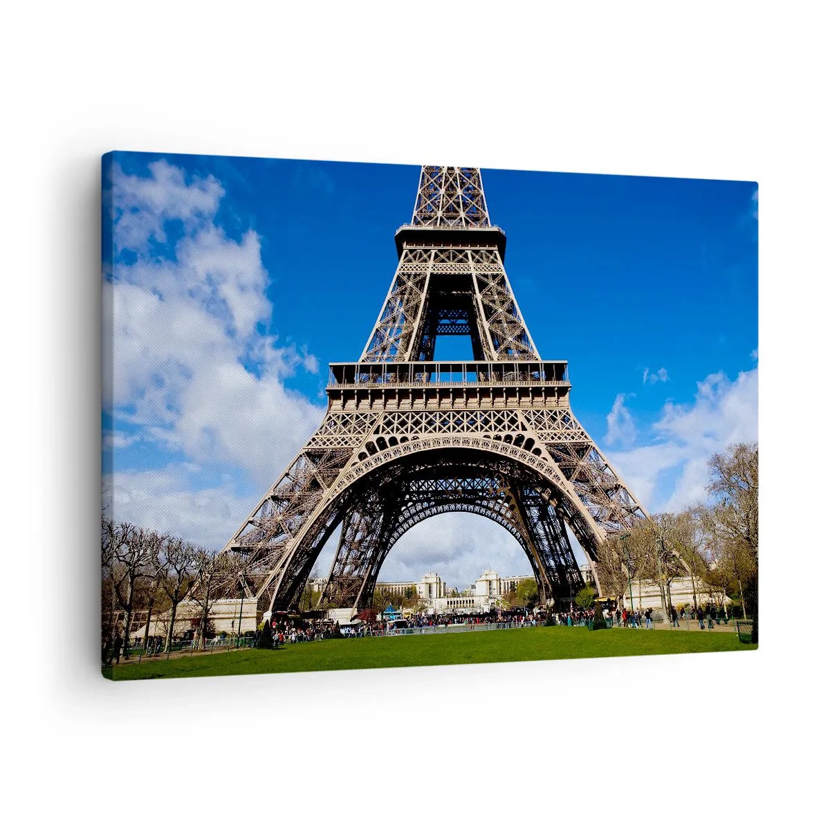Canvas picture - The Eiffel Tower against the background of a blue sky and a green park - 70x50cm - Whole Paris at Her Feet - Modern wall decoration for the living room and bedroom ARTTOR