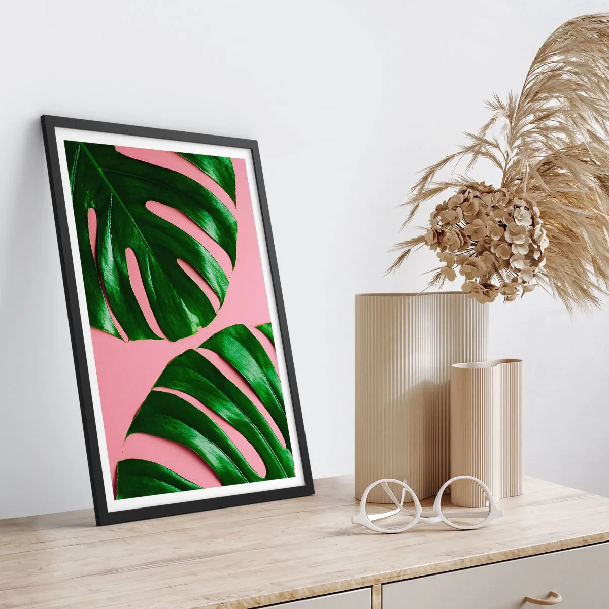 Poster in black frame - Monstera leaves on a pink background in a minimalist style - 50x70cm - Green Rendezvous - Modern wall decoration for the living room and bedroom ARTTOR