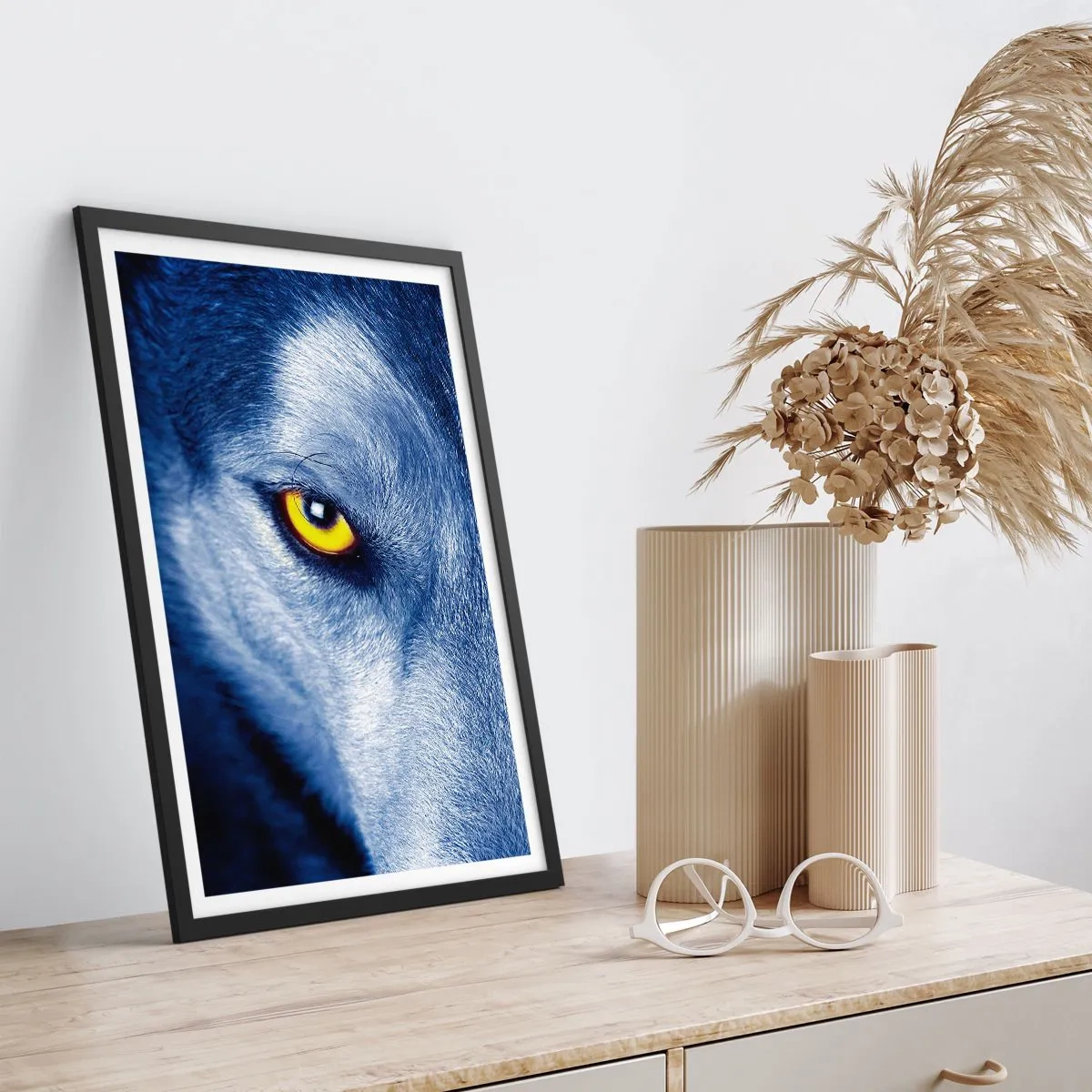 Poster in black frame - A close-up of a wolf's yellow eye in a blue tone - 50x70cm - Mesmerising Look - Modern wall decoration for the living room and bedroom ARTTOR