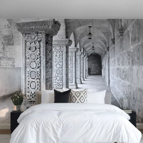 Photo Wallpaper Standard Eco - Stone columns with ornamentation in a monochromatic cloister - 100x70cm - Where is this Going...? - Modern wall decoration for the living room and bedroom ARTTOR