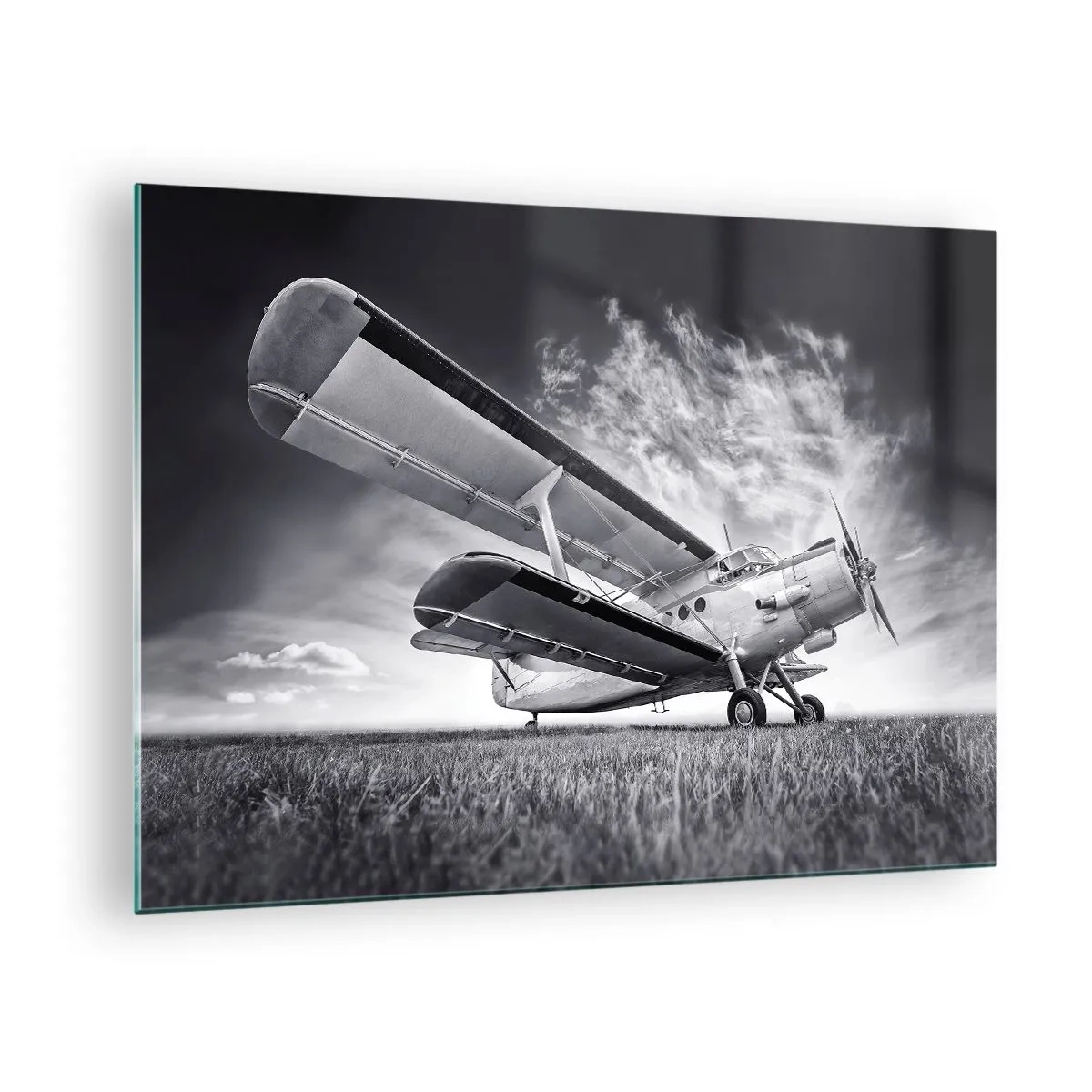 Glass picture - A black and white photograph of an airplane against a dramatic sky. - 70x50cm - Winged Pilgrim - Modern wall decoration for the living room and bedroom ARTTOR