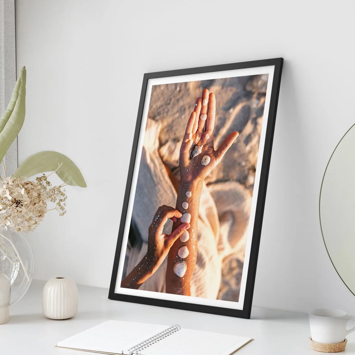 Poster in black frame - Hands decorated with shells on a sandy background - 50x70cm - Beauty at Hand - Modern wall decoration for the living room and bedroom ARTTOR
