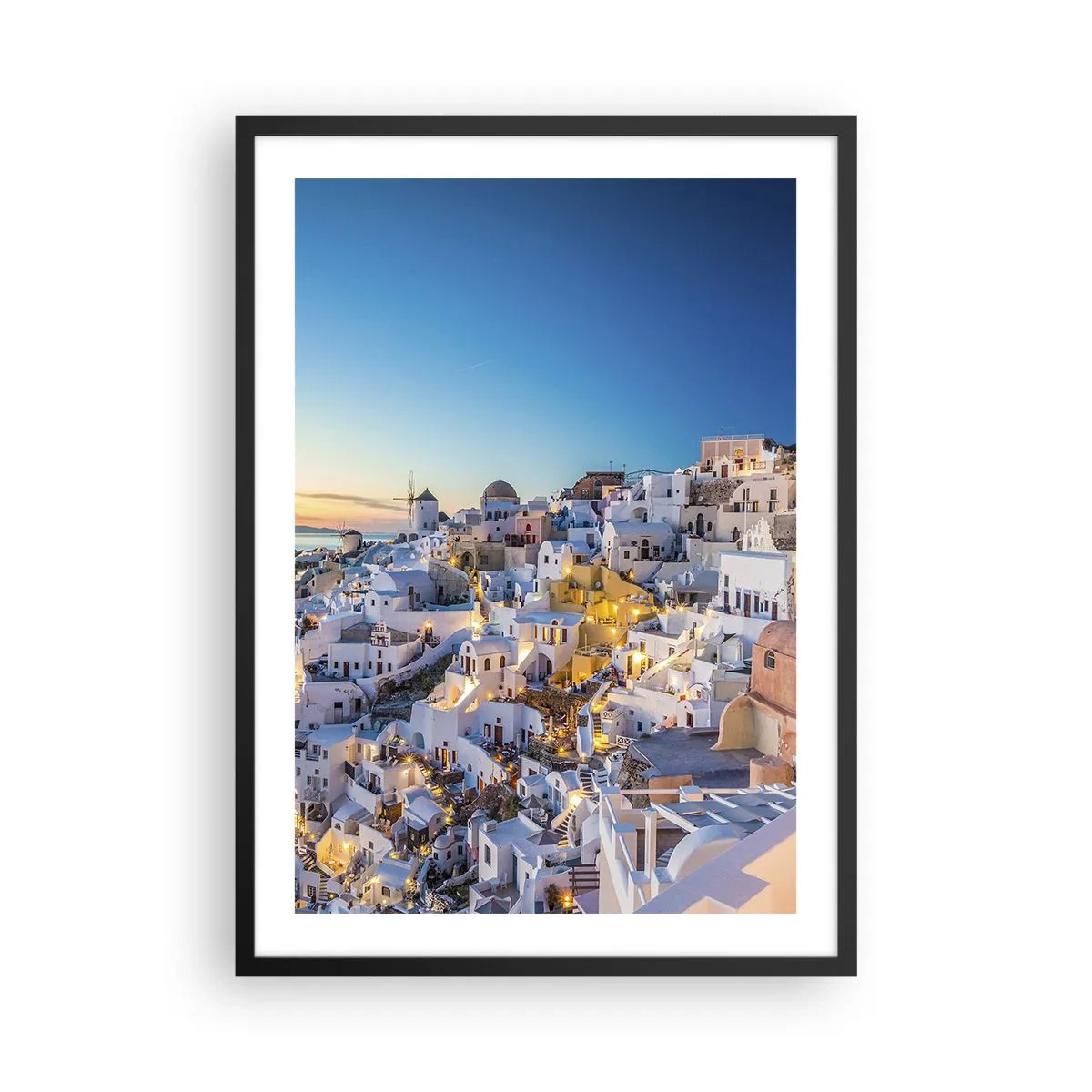 Poster in black frame - View of the illuminated houses in Santorini at sunset - 50x70cm - Essence of Greekness - Modern wall decoration for the living room and bedroom ARTTOR
