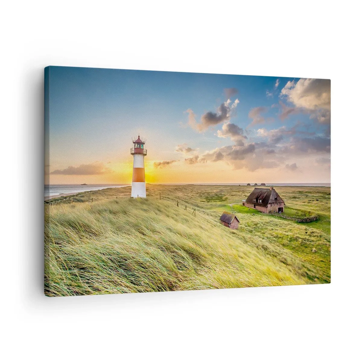 Canvas picture - A lighthouse with meadows and houses in the sun in the background - 70x50cm - Between Waves - Modern wall decoration for the living room and bedroom ARTTOR
