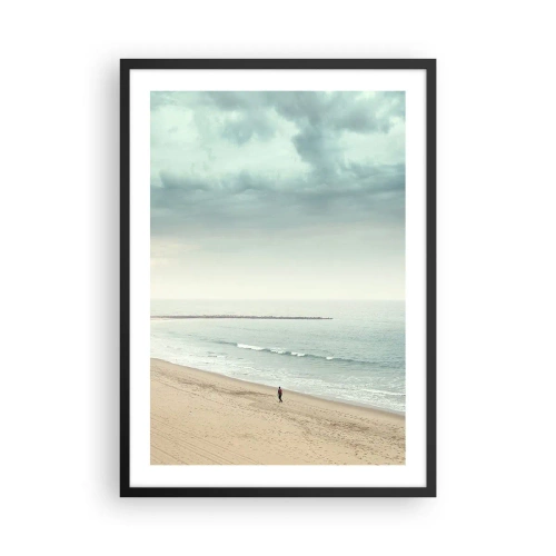 Poster in black frame - A lone figure walks along the seashore under an overcast sky. - 50x70cm - In Search of Quiet - Modern wall decoration for the living room and bedroom ARTTOR