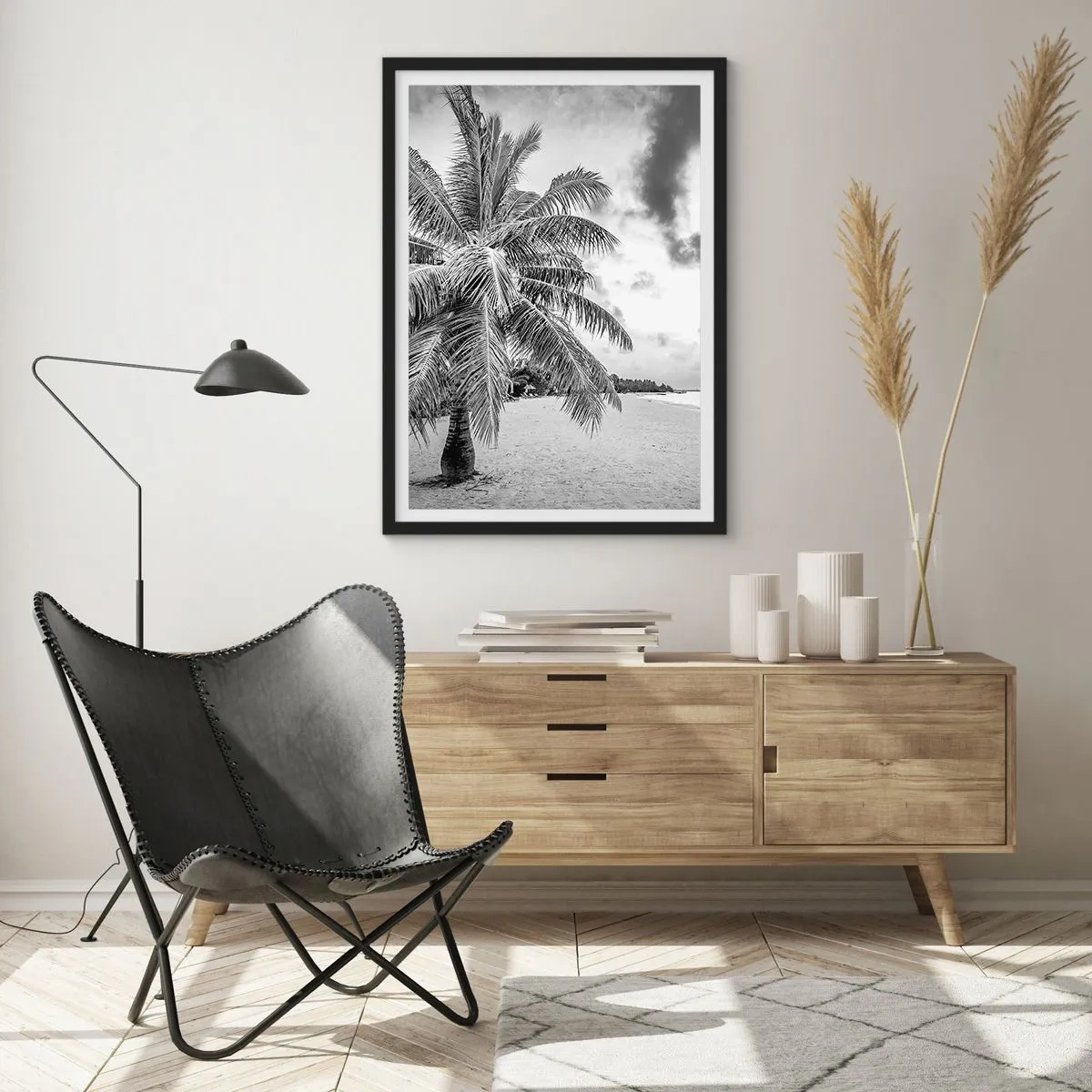 Poster in black frame - A black and white palm tree on an empty beach under a cloudy sky. - 50x70cm - When You Miss Loneliness… - Modern wall decoration for the living room and bedroom ARTTOR