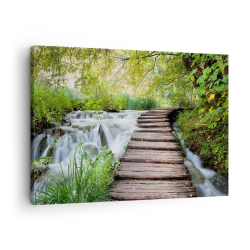 Canvas picture - A wooden bridge over a waterfall surrounded by lush green forest. - 70x50cm - Not Such Quiet Water - Modern wall decoration for the living room and bedroom ARTTOR