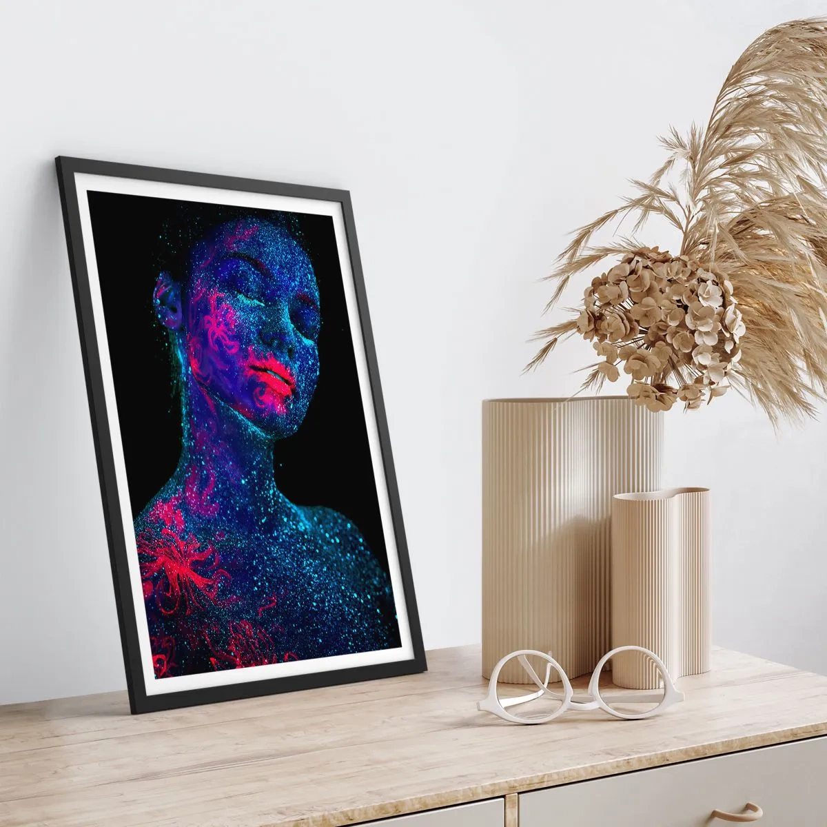 Poster in black frame - A woman covered in fluorescent pollen under UV light. - 50x70cm - In Stardust - Modern wall decoration for the living room and bedroom ARTTOR